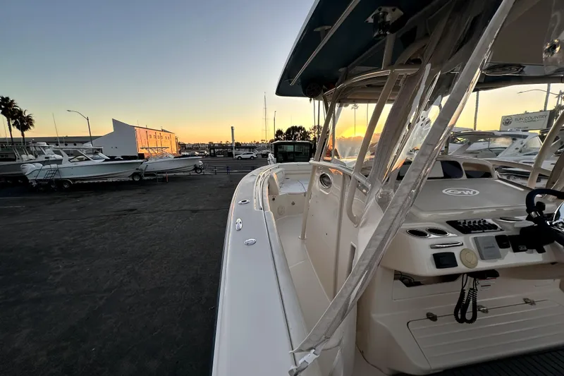 Killer B Yacht Photos Pics 2019 Grady-White Canyon 336 boat at sunset in a marina setting.