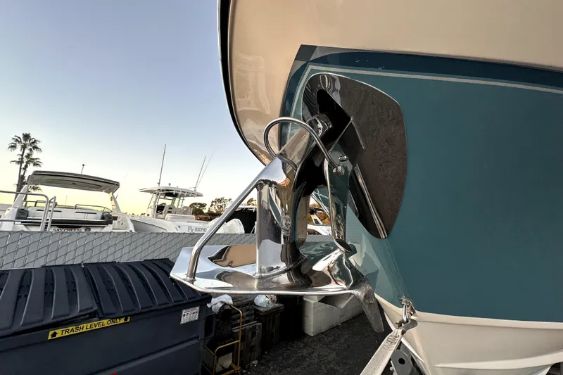 Killer B Yacht Photos Pics 2019 Grady-White Canyon 336 boat anchor detail with marina background.