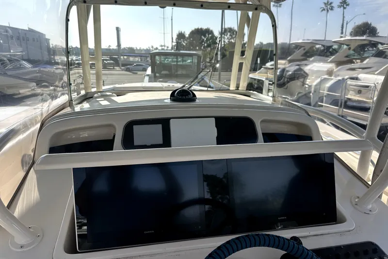 Killer B Yacht Photos Pics 2019 Grady-White Canyon 336 boat dashboard with navigation screens and steering wheel.