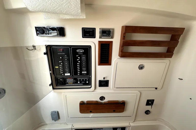 Killer B Yacht Photos Pics 2019 Grady-White Canyon 336 boat interior control panel with wooden accents.