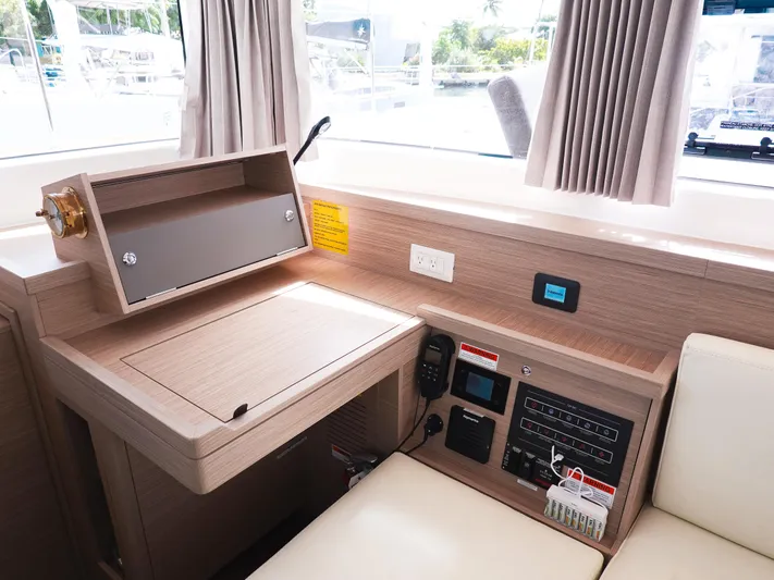 Cloud Walker Yacht Photos Pics 2024 Lagoon 40 yacht interior with navigation station and control panel.