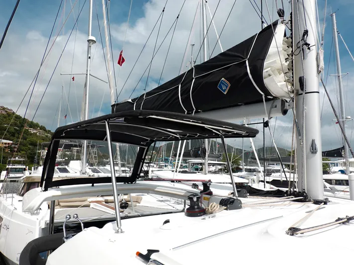 Cloud Walker Yacht Photos Pics 2024 Lagoon 40 catamaran docked at marina, featuring sleek design and modern sail setup.