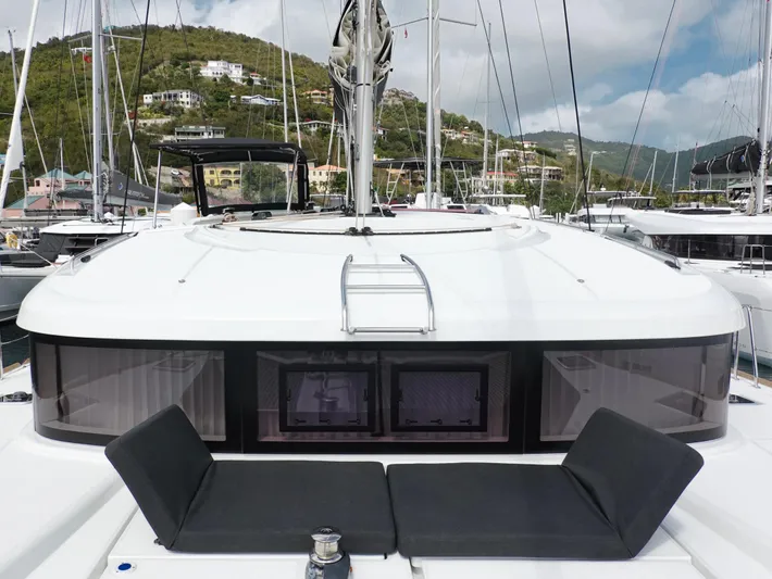 Cloud Walker Yacht Photos Pics 2024 Lagoon 40 catamaran with sleek design, docked in a scenic marina.