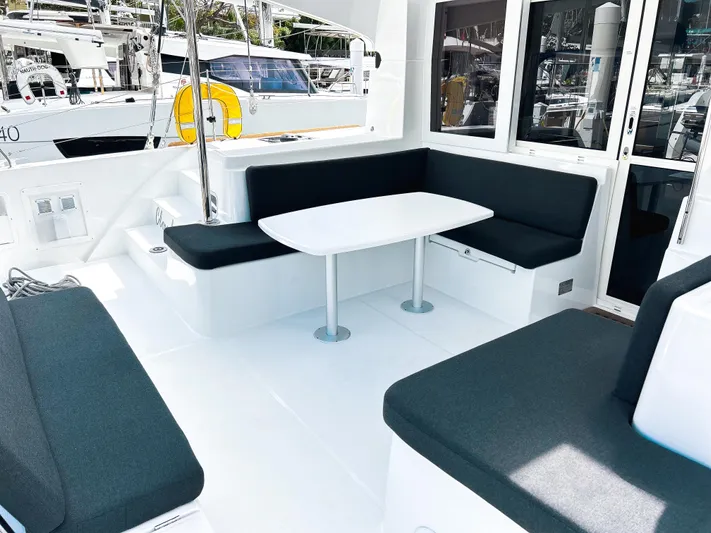 Cloud Walker Yacht Photos Pics 2024 Lagoon 40 yacht cockpit with sleek seating and modern table design.