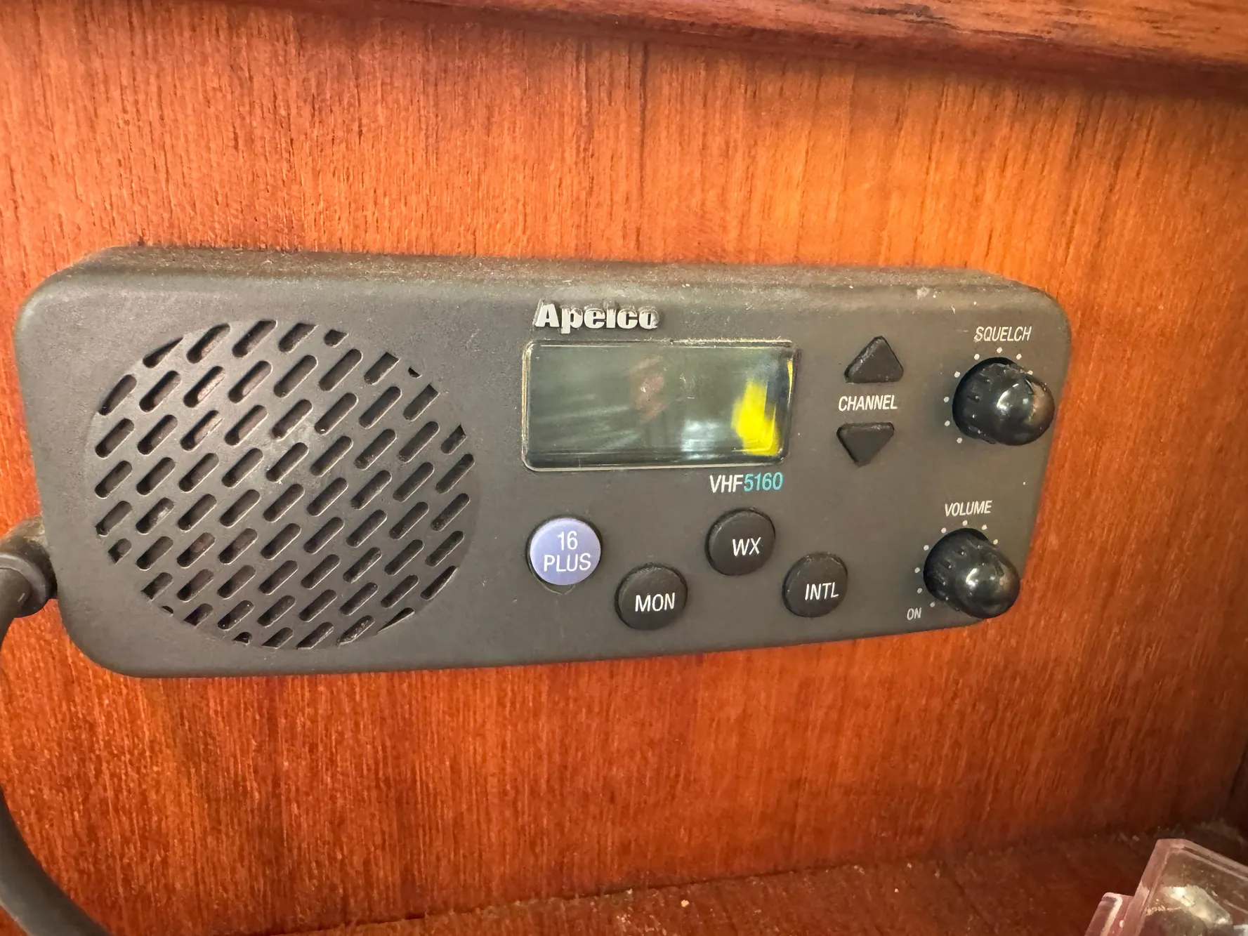 VHF radio on 1994 Hunter 29.5 sailboat, mounted on wooden panel.