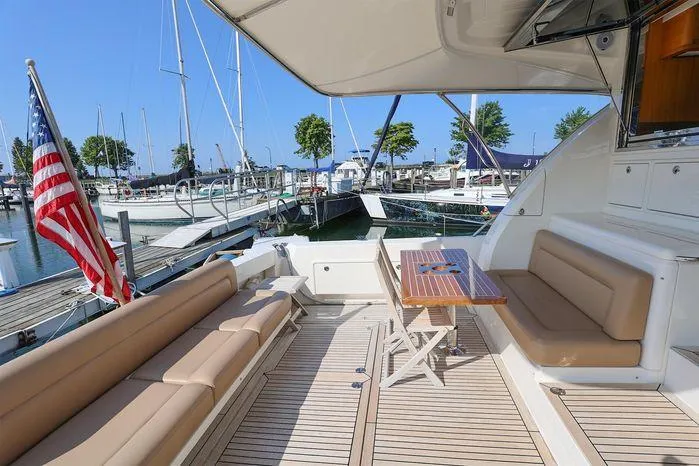 Eagle Yacht Photos Pics 2016 Riviera 525 SUV yacht with spacious deck and marina view.