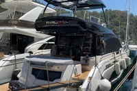 2023 Cranchi E52F yacht docked at marina, sleek design, luxury features.