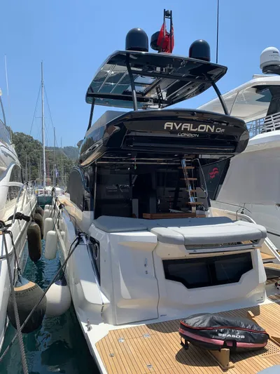  Yacht Photos Pics 2023 Cranchi E52F yacht docked at marina, rear view.