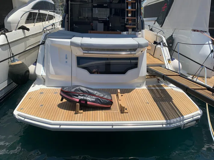  Yacht Photos Pics 2023 Cranchi E52F yacht with teak deck, docked at marina.