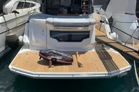 2023 Cranchi E52F yacht with teak deck, docked at marina.