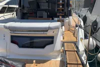 2023 Cranchi E52F yacht docked, featuring spacious deck and modern design.