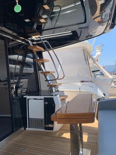  Yacht Photos Pics 2023 Cranchi E52F yacht interior with sleek staircase and modern design.