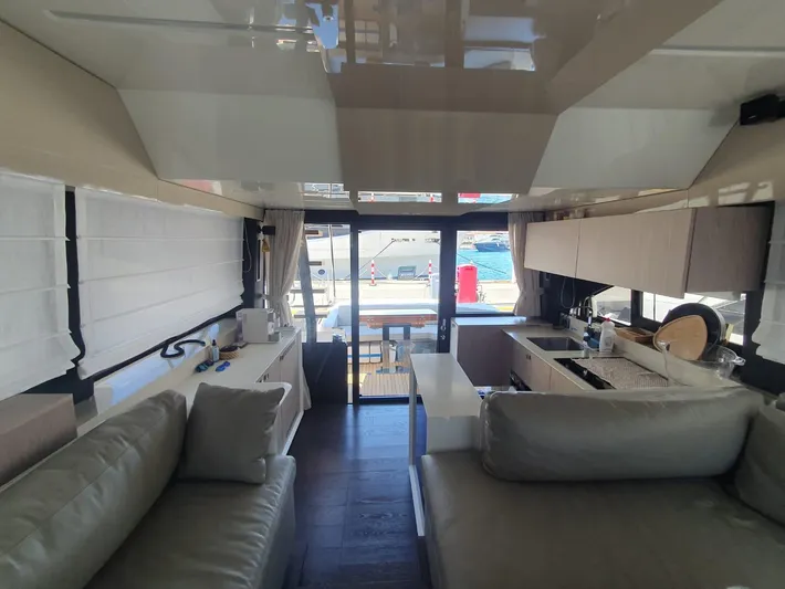  Yacht Photos Pics Interior of 2023 Cranchi E52F yacht, featuring modern kitchen and seating area.