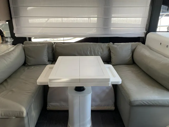  Yacht Photos Pics Luxurious interior of 2023 Cranchi E52F yacht with modern seating and table.