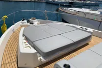 2023 Cranchi E52F yacht with spacious sunbathing deck, docked at marina.
