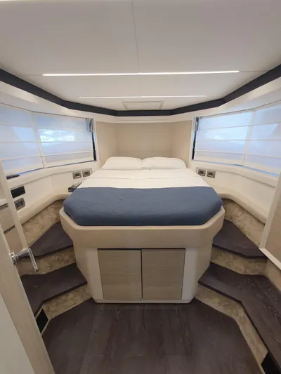  Yacht Photos Pics Luxurious 2023 Cranchi E52F yacht bedroom with modern design and cozy bedding.