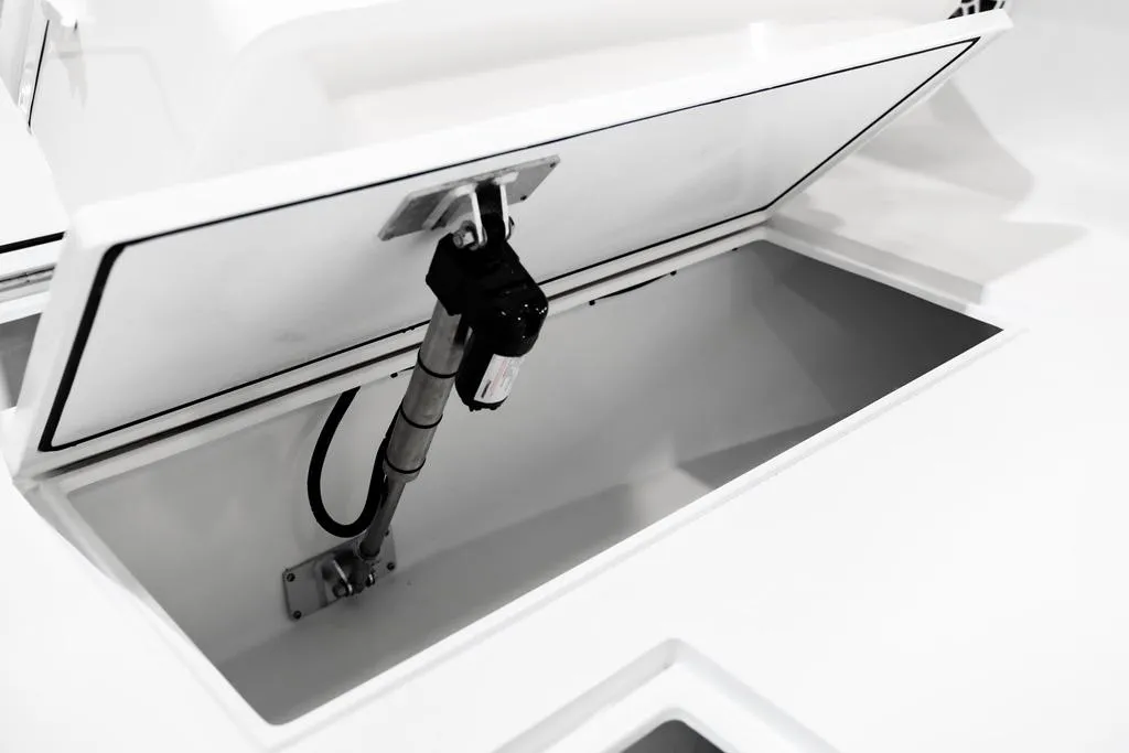 Open storage compartment on 2026 Contender 28 Tournament boat, showcasing interior details.