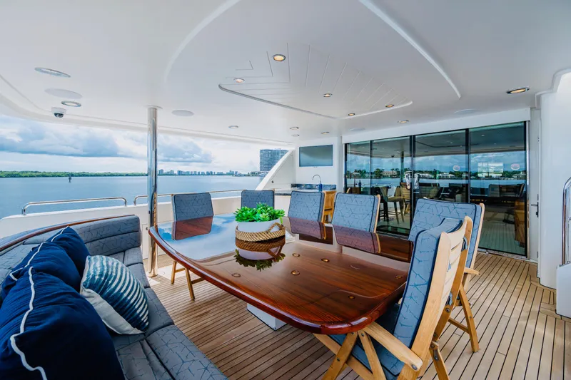 Lila Cuy Yacht Photos Pics Luxurious 2006 Westport w112 yacht deck with elegant dining area and scenic ocean view.