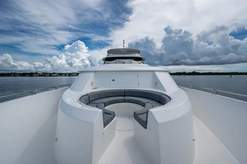Lila Cuy Yacht Photos Pics Luxurious 2006 Westport w112 yacht with spacious deck seating under cloudy skies.