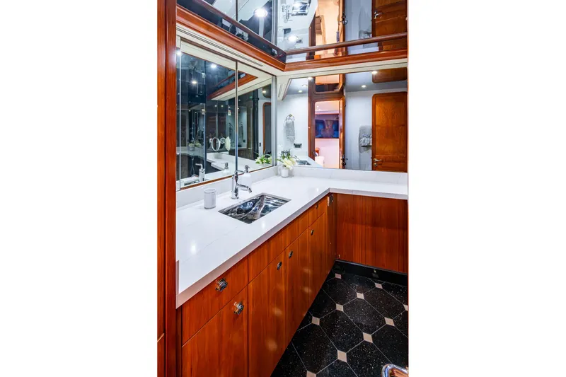 Lila Cuy Yacht Photos Pics Luxurious yacht bathroom with wood cabinetry, modern fixtures, and elegant design in a 2006 Westport w112.