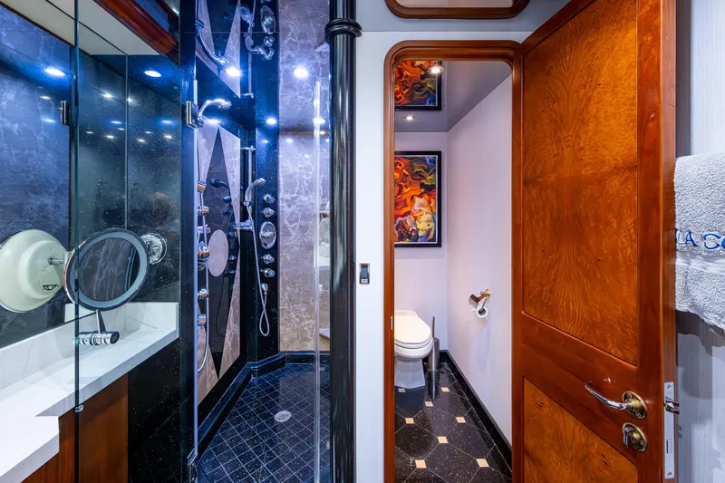 Lila Cuy Yacht Photos Pics Luxurious 2006 Westport w112 yacht bathroom with modern shower and elegant wood finishes.