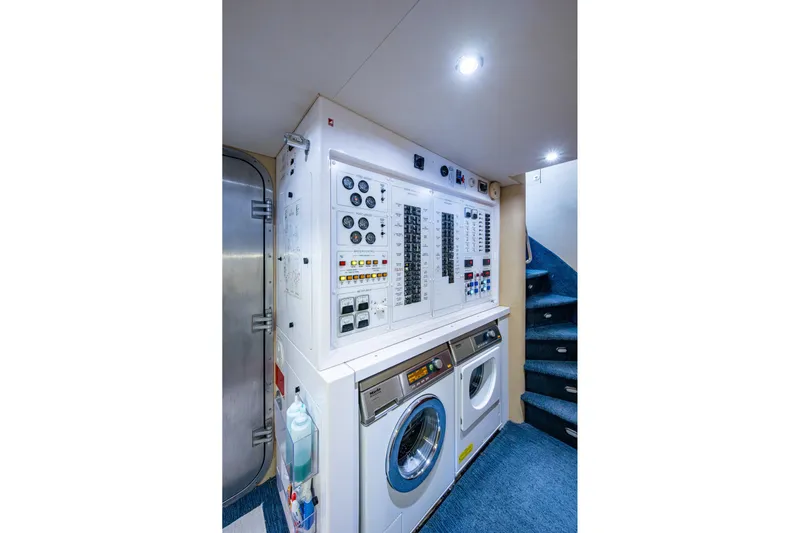Lila Cuy Yacht Photos Pics Laundry area with control panel in 2006 Westport w112 yacht, featuring washer and dryer.