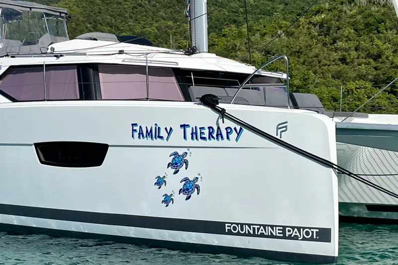 Family Therapy Yacht Photos Pics 2023 Fountaine Pajot Elba 45 Catamaran named "Family Therapy" with turtle graphics.