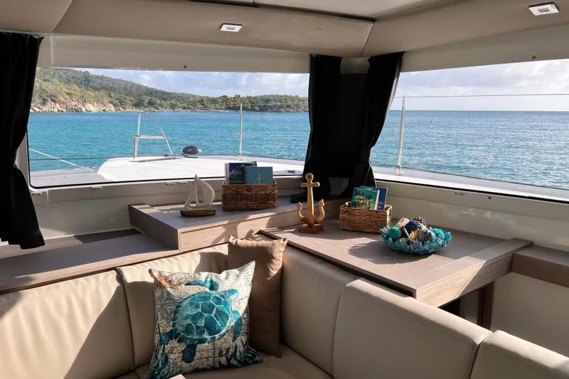 Family Therapy Yacht Photos Pics Luxurious interior of 2023 Fountaine Pajot Elba 45 Catamaran with ocean view.