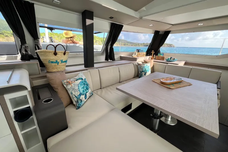Family Therapy Yacht Photos Pics Luxurious interior of 2023 Fountaine Pajot Elba 45 Catamaran with ocean view.