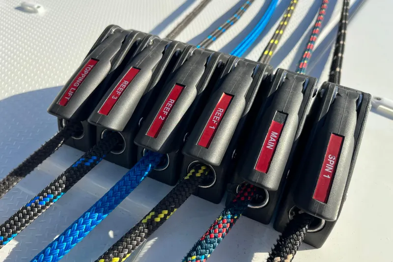 Family Therapy Yacht Photos Pics Close-up of labeled rope clutches on a 2023 Fountaine Pajot Elba 45 Catamaran.