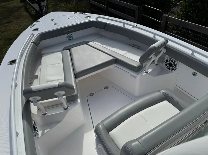  Yacht Photos Pics 2024 Everglades 253 Center Console boat interior with cushioned seating and modern design.