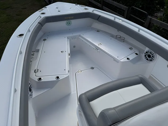  Yacht Photos Pics 2024 Everglades 253 Center Console boat interior with seating and storage compartments.