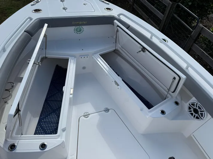  Yacht Photos Pics 2024 Everglades 253 Center Console boat with open storage compartments.