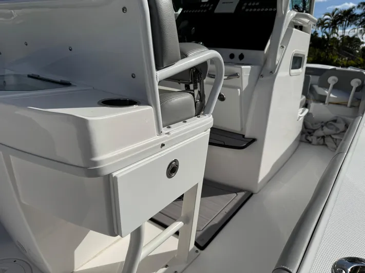  Yacht Photos Pics 2024 Everglades 253 Center Console boat interior with seating and control panel.