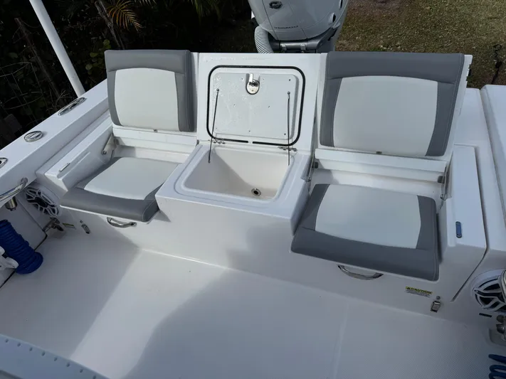  Yacht Photos Pics 2024 Everglades 253 Center Console boat seating and storage area.