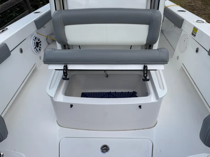  Yacht Photos Pics 2024 Everglades 253 Center Console boat interior with storage compartment and seating.