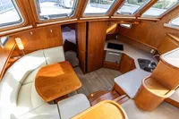 Luxurious 2005 Vripack Spiegelkotter 14.50 yacht interior with wood finish and modern amenities.