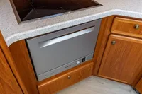 Modern kitchen in 2005 Vripack Spiegelkotter 14.50 yacht with stove and dishwasher.