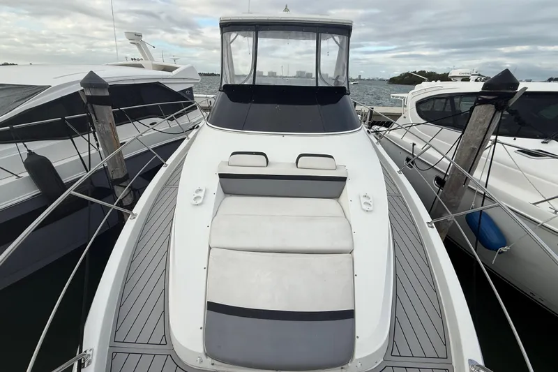  Yacht Photos Pics 2009 Carver 44 Sojourn yacht docked, showcasing sleek design and spacious deck.