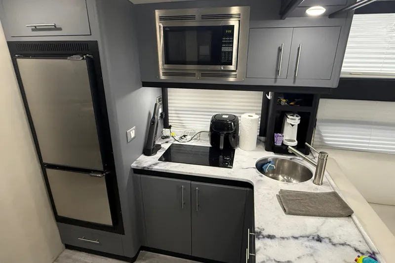  Yacht Photos Pics Modern kitchen in 2009 Carver 44 Sojourn yacht with appliances and marble countertop.