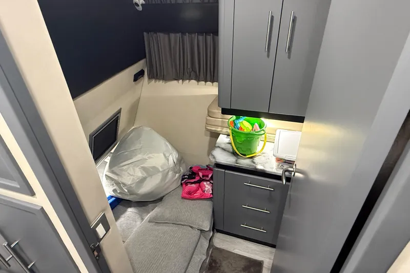  Yacht Photos Pics Interior cabin of 2009 Carver 44 Sojourn yacht with storage and seating area.