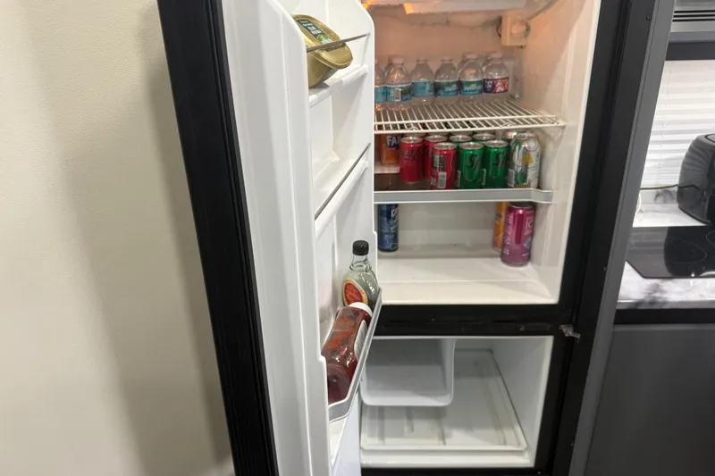  Yacht Photos Pics Open refrigerator in 2009 Carver 44 Sojourn yacht, stocked with drinks and condiments.