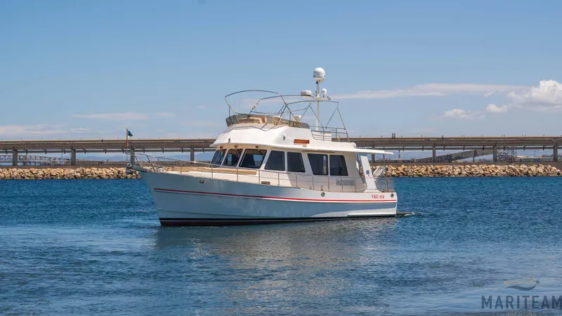 American Dream Yacht Photos Pics 2011 Grand Banks 41 Heritage EU yacht on calm blue water under clear sky.