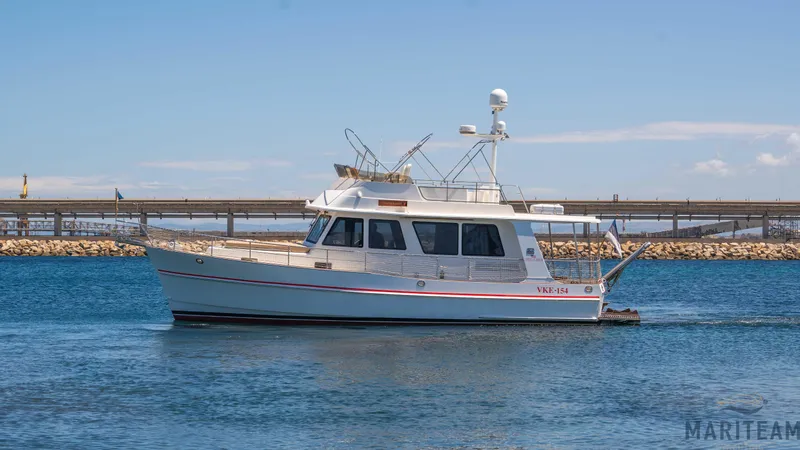 American Dream Yacht Photos Pics 2011 Grand Banks 41 Heritage EU yacht cruising on calm waters under a clear sky.