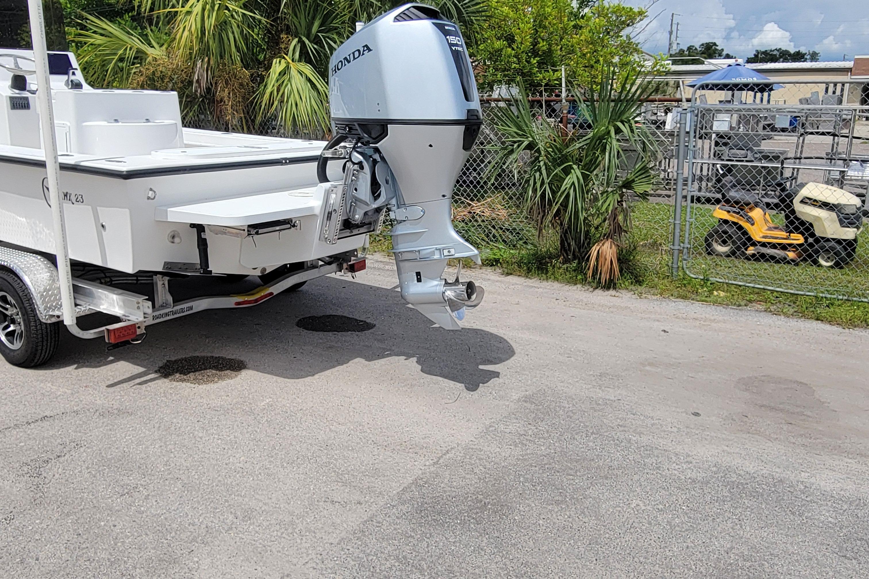 2025 C-Hawk 23CC boat with Honda outboard motor on a trailer.
