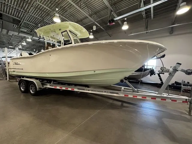  Yacht Photos Pics 2025 Pioneer Pelagic 270 boat on trailer in indoor showroom.