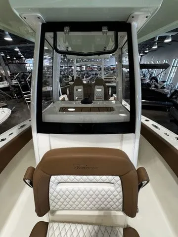  Yacht Photos Pics 2025 Pioneer Pelagic 270 boat interior with brown and white seating, showroom display.