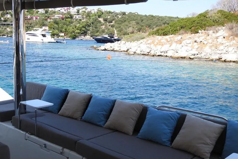  Yacht Photos Pics Luxurious Lagoon 560 S2 yacht with scenic coastal view, 2014 model.