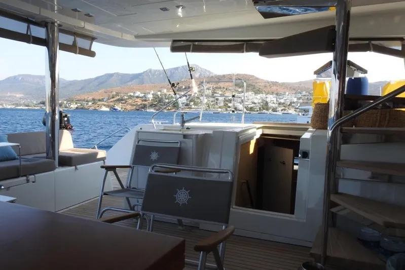  Yacht Photos Pics Interior view of 2014 Lagoon 560 S2 yacht with scenic ocean backdrop.