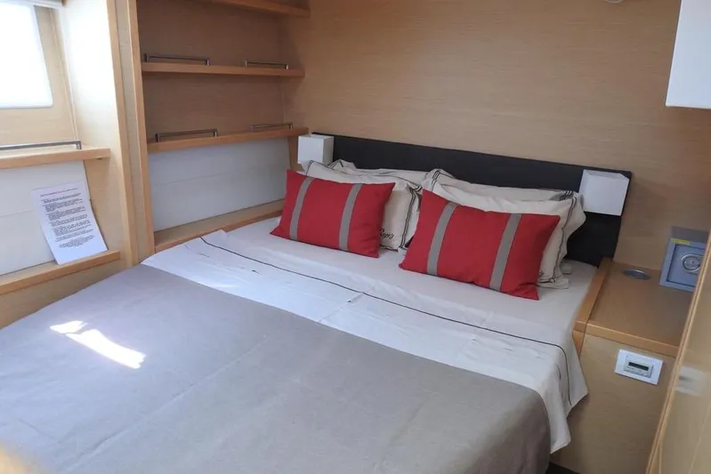  Yacht Photos Pics Luxurious cabin interior of 2014 Lagoon 560 S2 yacht with cozy bed and modern decor.